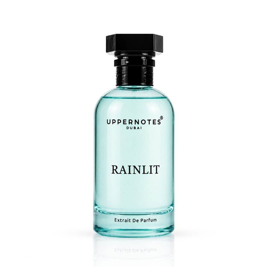 Perfume bottle labeled 'Rainlit' by Uppernotes Dubai on a white background