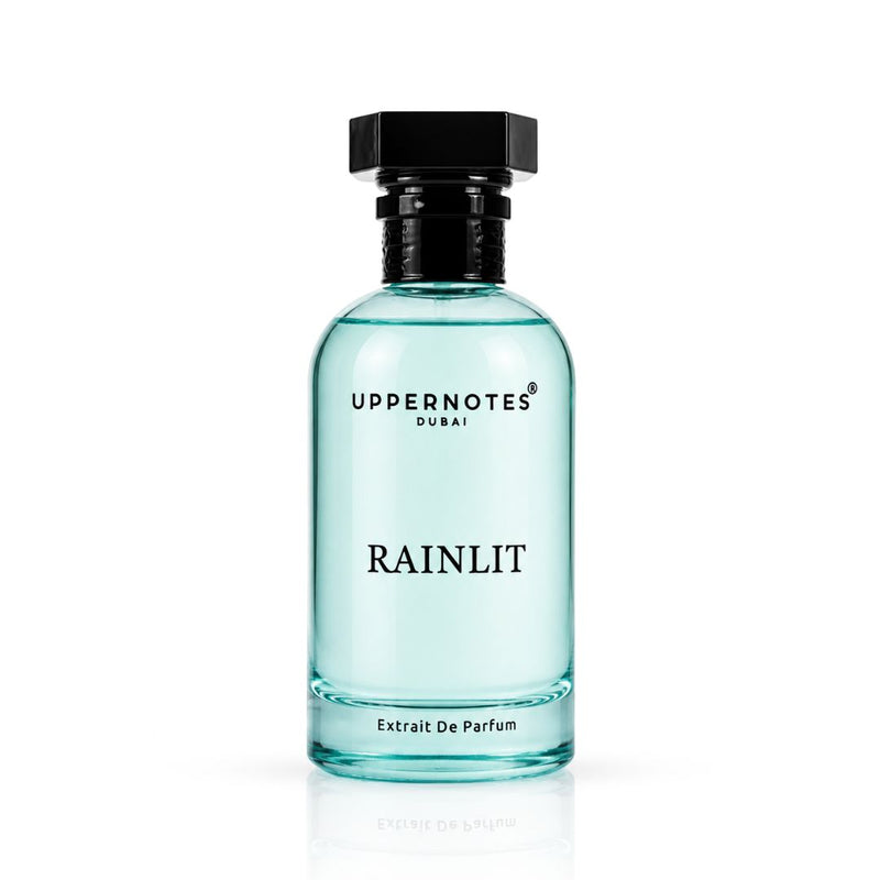 Perfume bottle labeled 'Rainlit' by Uppernotes Dubai on a white background