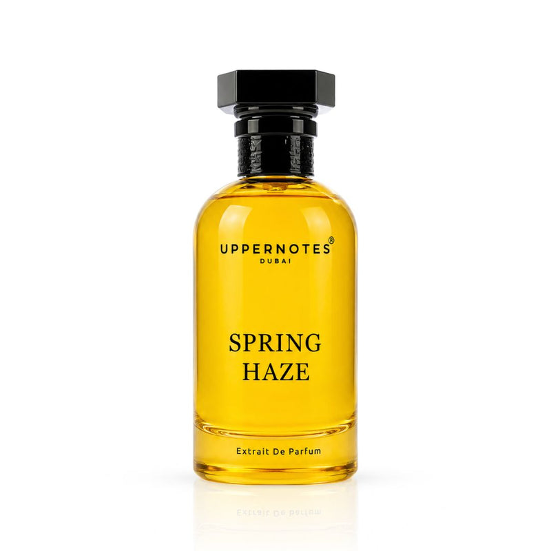 Yellow perfume bottle labeled 'Spring Haze' by Uppernotes on a white background