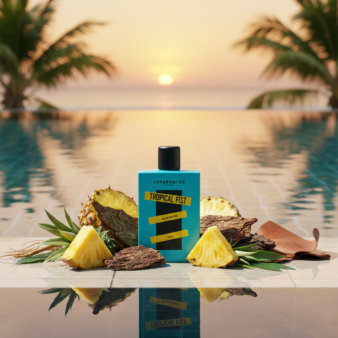 Tropical Fist cologne bottle with pineapple and leaves by a pool at sunset unsiex trending perfume in UAE