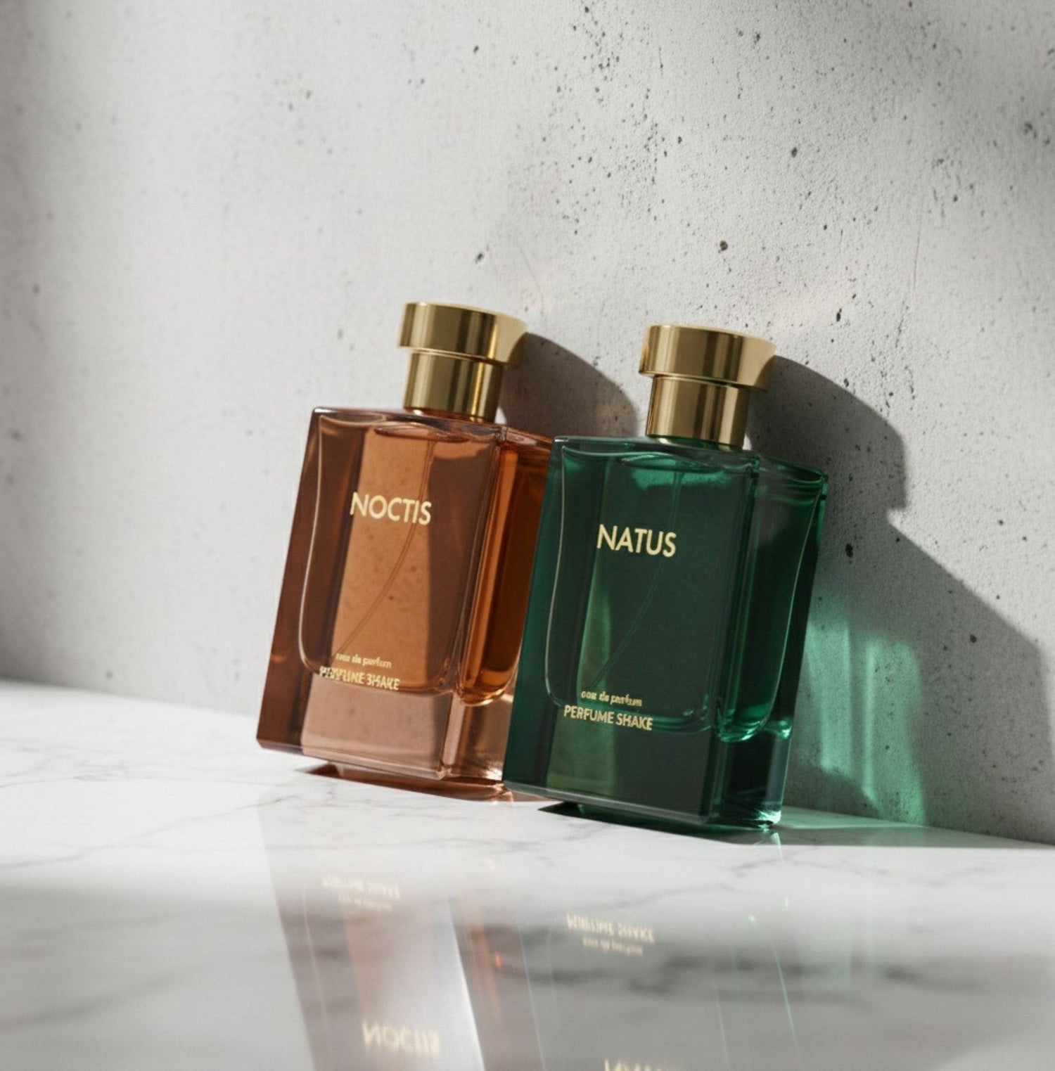 Two perfume bottles, one brown and one green, on a reflective surface with a light gray background. inspired by Famous star Shahrukh khan favourite perfumes in UAE